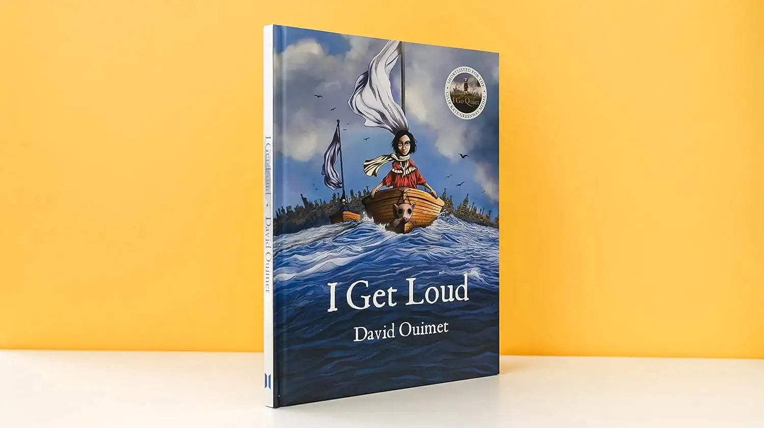 Book titled 'I Get Loud' by David Quinter with a colorful cover on a yellow background