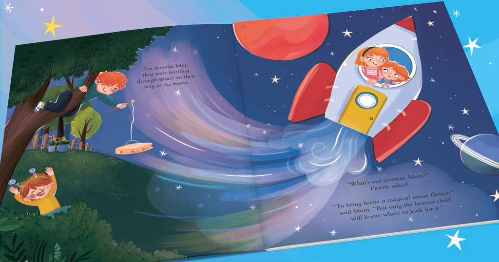An open children's picture book spread showing a colorful outer-space scene with a rocket ship, planets, stars, and children in a treehouse scene. The pages are photographed against a light blue background with star graphics.